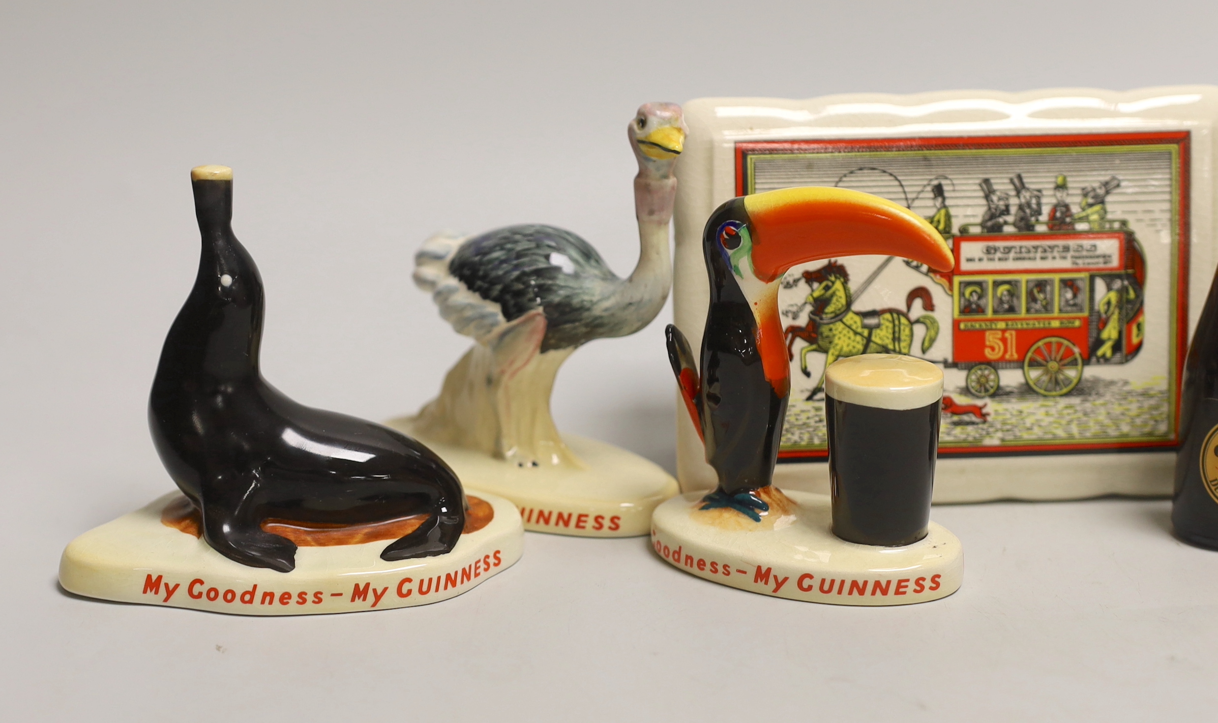 Six Carltonware Guinness advertising models, three related bottles and a rectangular box